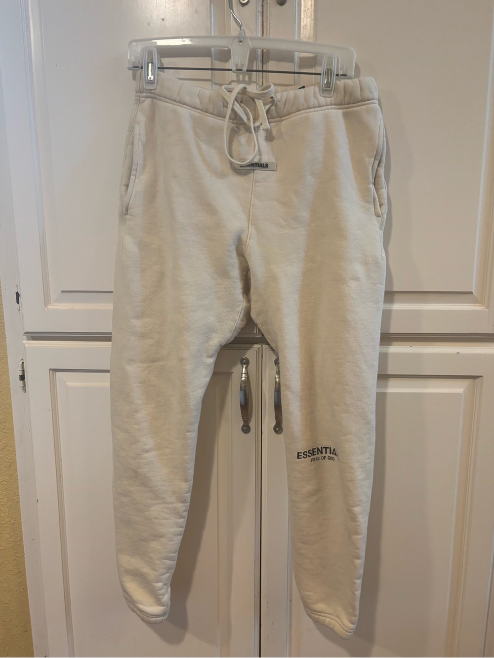 Fear of God Essentials cream jogger pants. Small